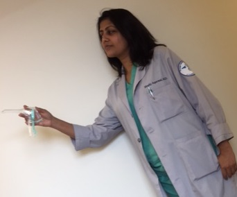 Dr. Shelly holding Small Speculum